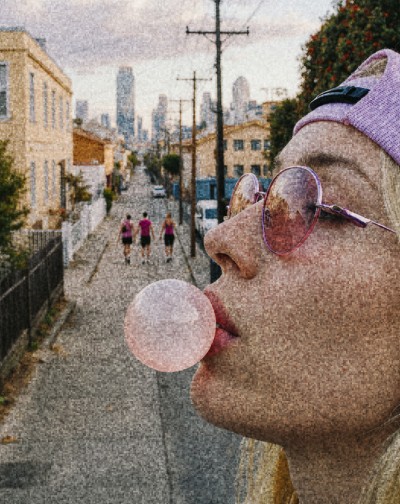 Woman blowing a bubble-gum bubble